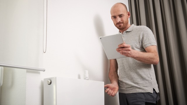 installer checking radiator