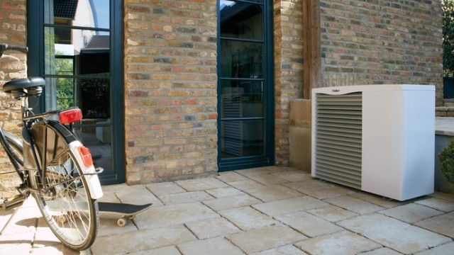 aroTHERM heat pump outside with a bike and skateboard 