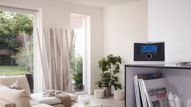 a control on a shelf in a living room