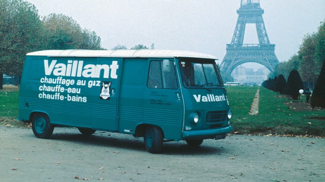 a Vaillant green van outside the Eiffel Tower in Paris.