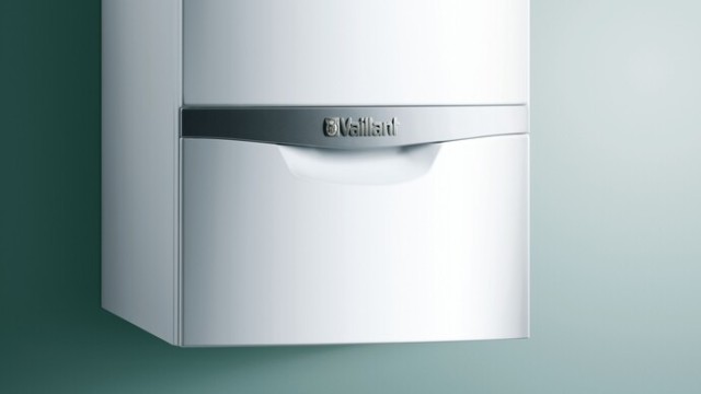 Compact boiler on a green background