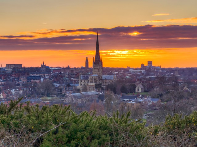 Sunset over Norwich with a church spire