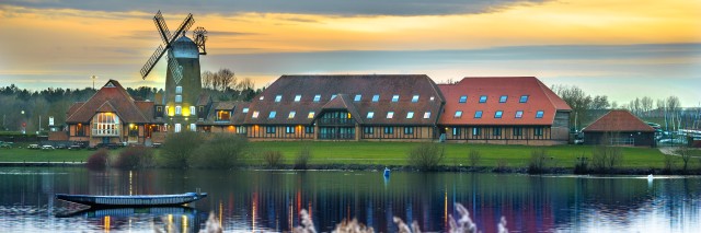A panoramic picture of the windmill at Caldecotte Lake in Milton Keynes at sunset