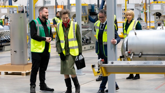 HRH Princess Royal walking through the cylinder plant.