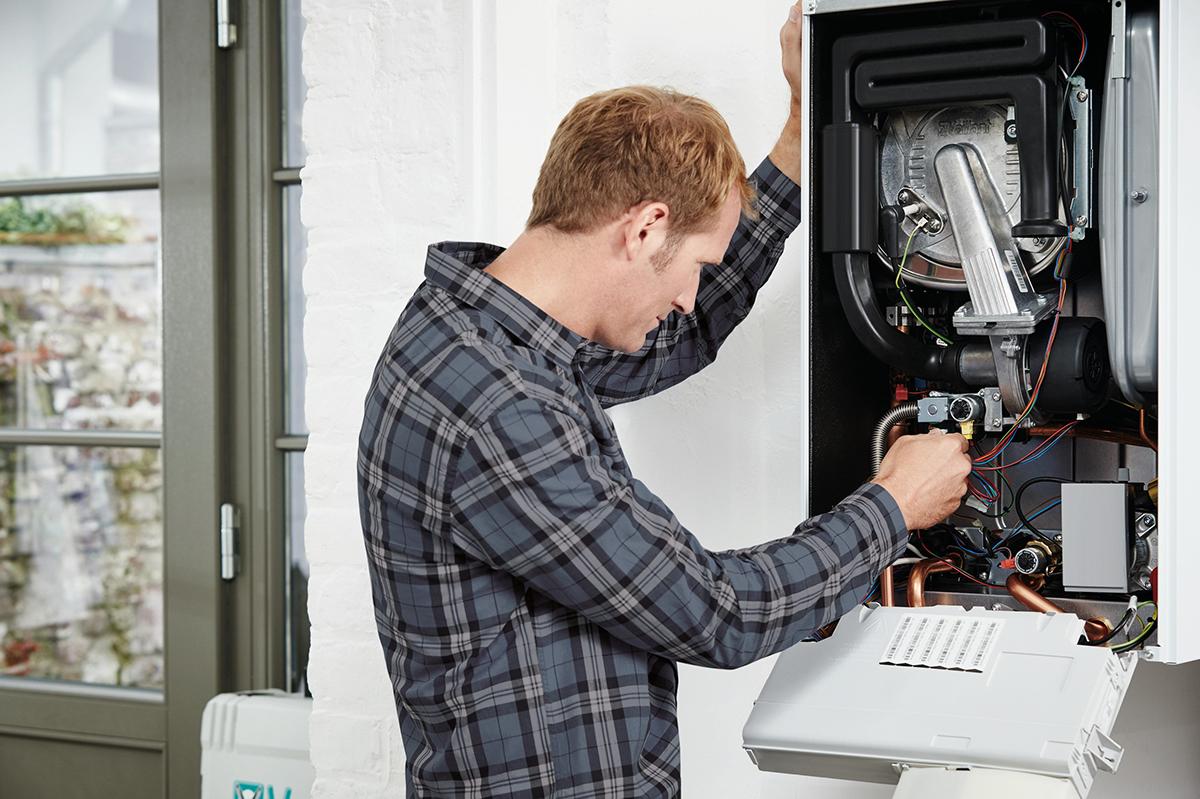 installer carrying out work on a boiler