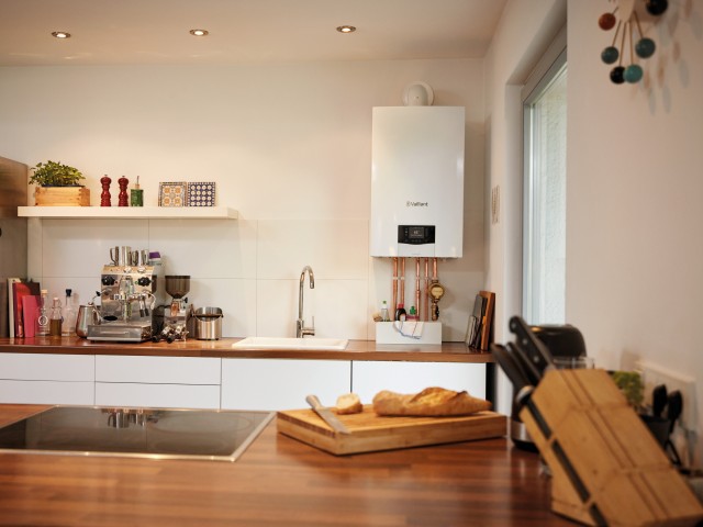 View of a kitchen from a wooden worktop with Vaillant ecoTEC plus in the background