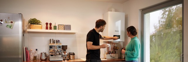 installer showing a woman her boiler