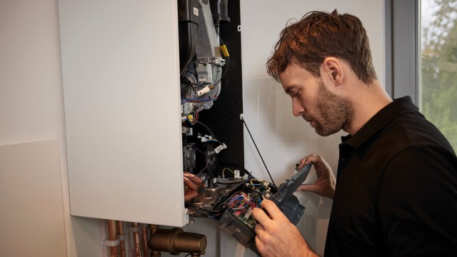 installer carrying out work on a boiler