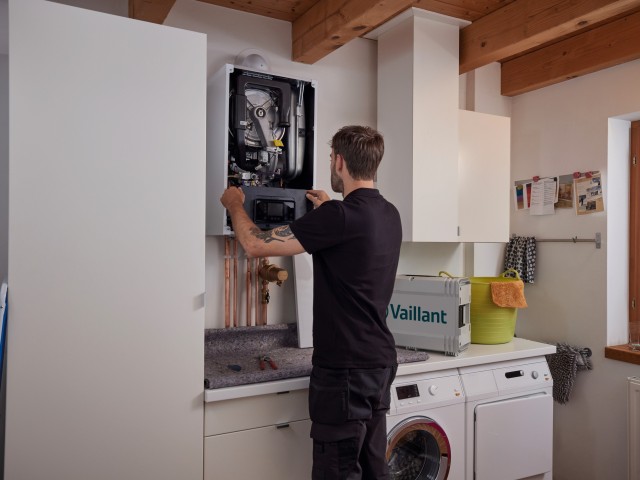 installer carrying out work on a boiler 