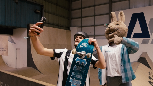 The Vaillant hare mascot taking a selfie with a skateboarder at Arenalline Alley skate park
