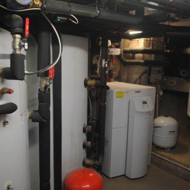 heat pump and cylinder inside a home