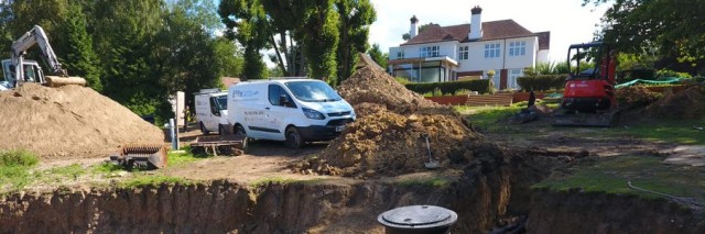 a house on a hill when fittings for a ground source heat pump in the ground.