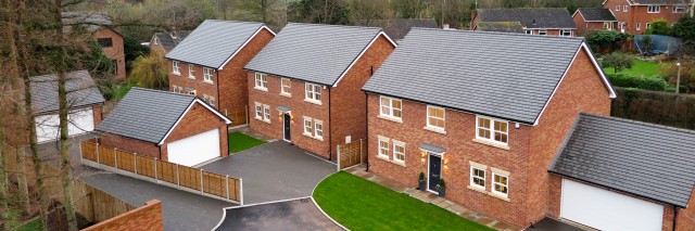 airel view of three red brick house