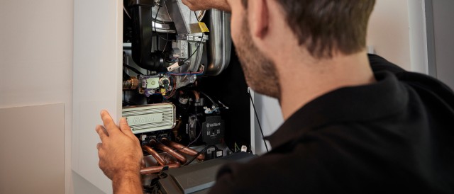 installer working on a boiler