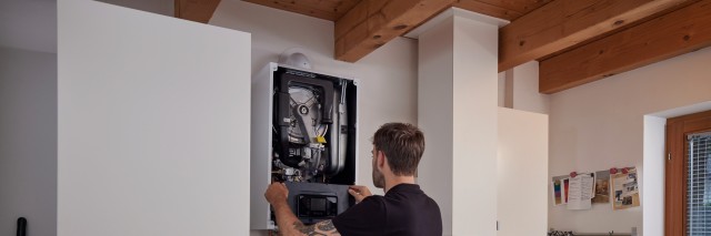 installer working inside a boiler 