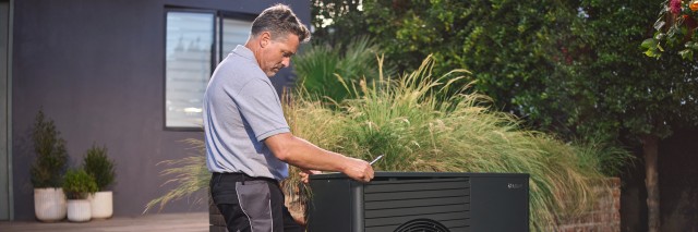man installing an aroTHERM plus heat pump