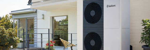 side view of a 12kW aroTHERM heat pump outside home