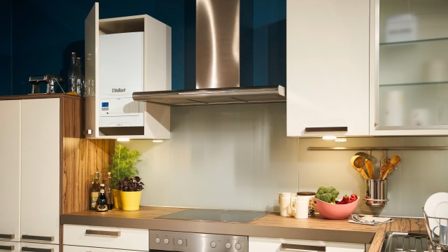 boiler in the kitchen cupboard with other kitchen appliances