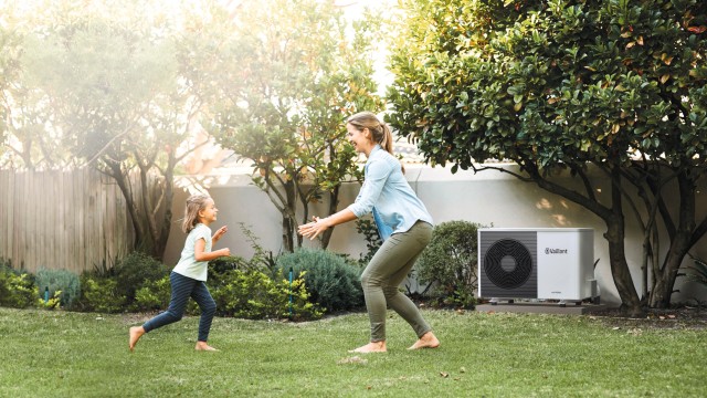 Mother and daughter in garden with aroTHERM plus in background