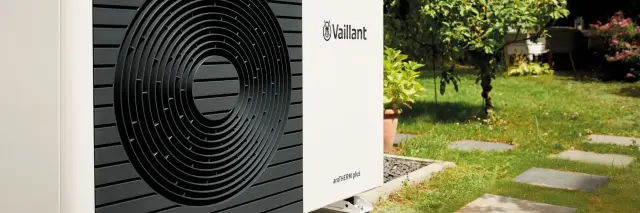 aroTHERM plus heat pump side view with grass