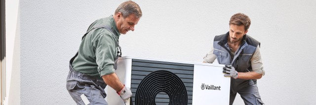 installer doing work on an aroTHERM plus heat pump