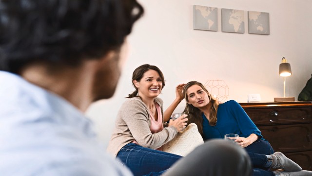 Three people talking